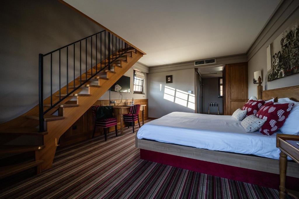 Postel nebo postele na pokoji v ubytování Hôtel Arnold