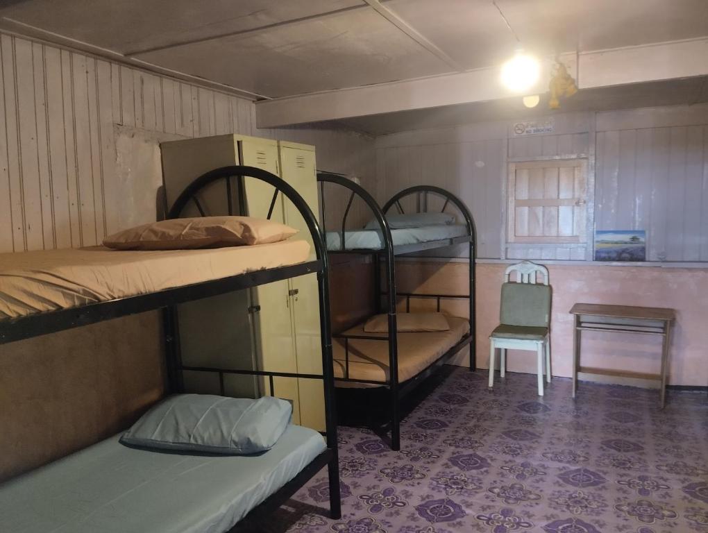 Postel nebo postele na pokoji v ubytování Dorm teriang