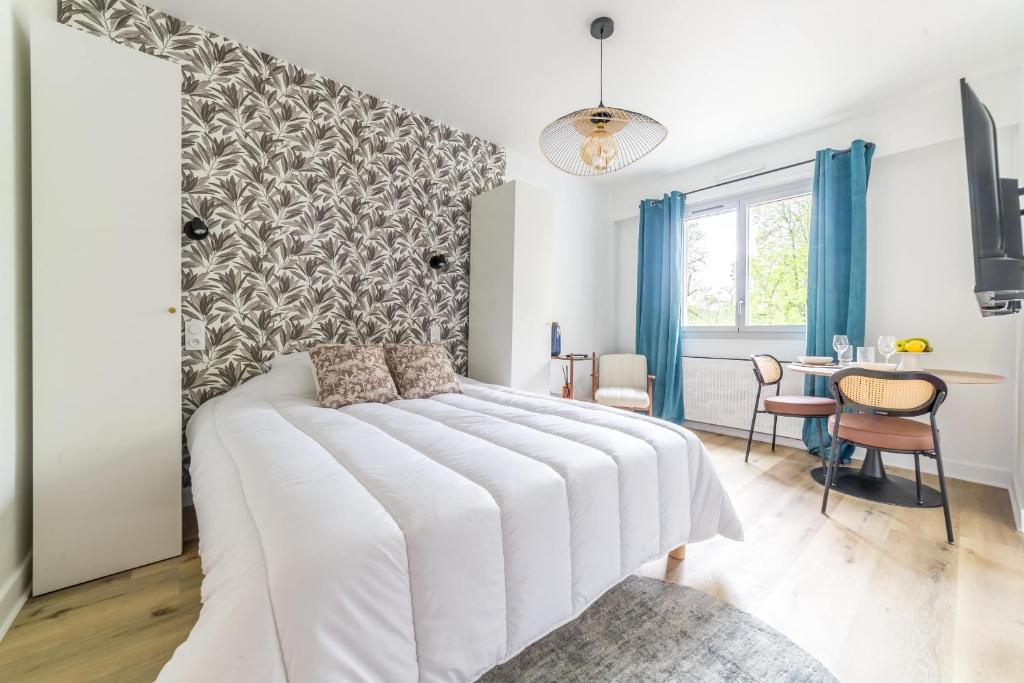 Postel nebo postele na pokoji v ubytování L'Ecrin de la Guierle - 1 Chambre