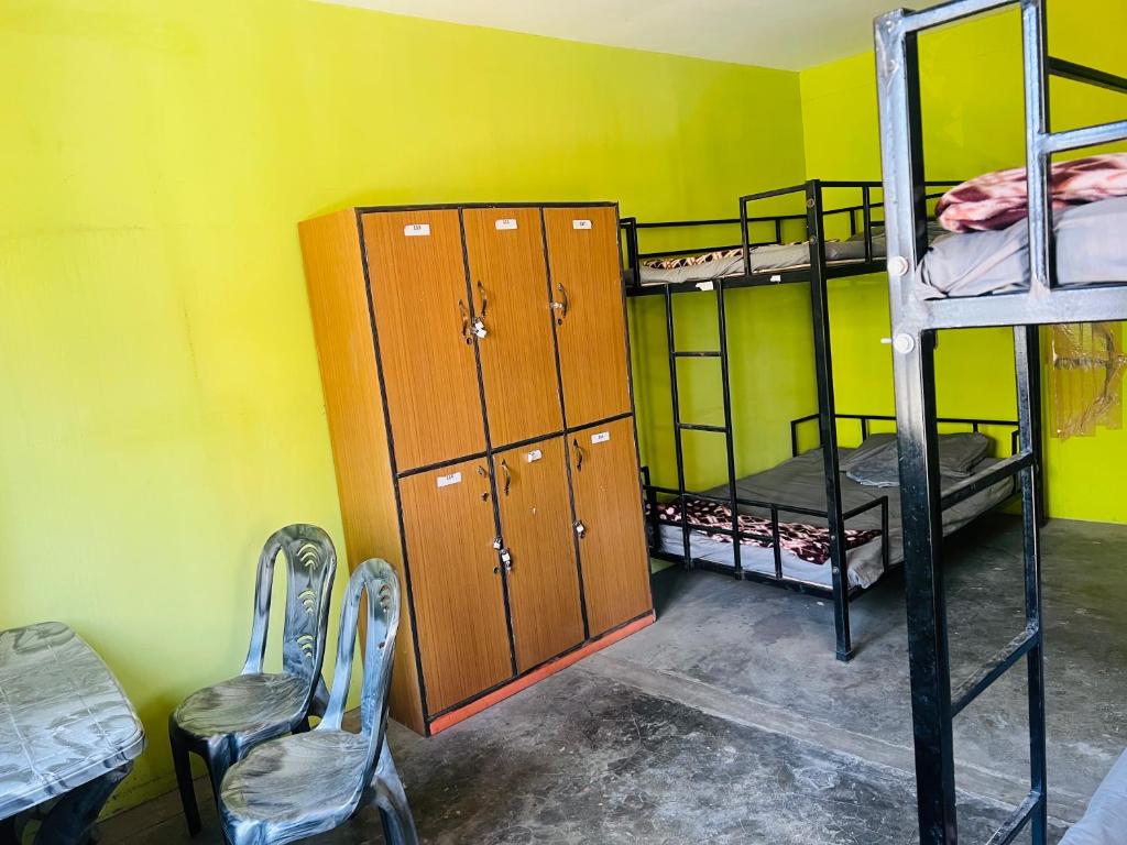 Postel nebo postele na pokoji v ubytování Veda Dormitory