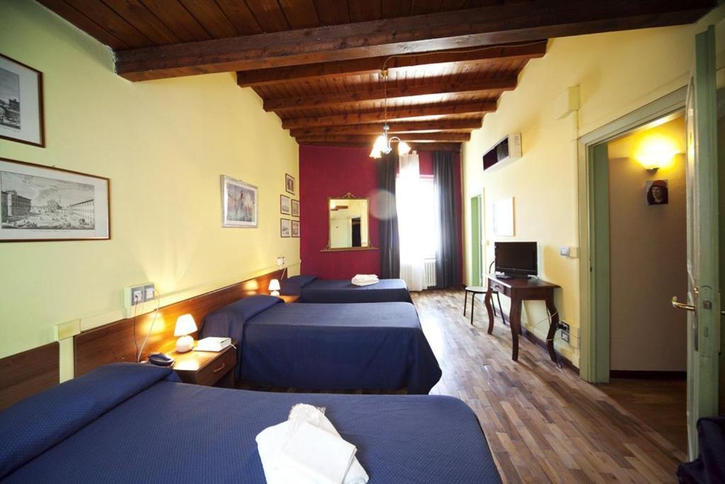 Postel nebo postele na pokoji v ubytování Hotel San Lorenzo