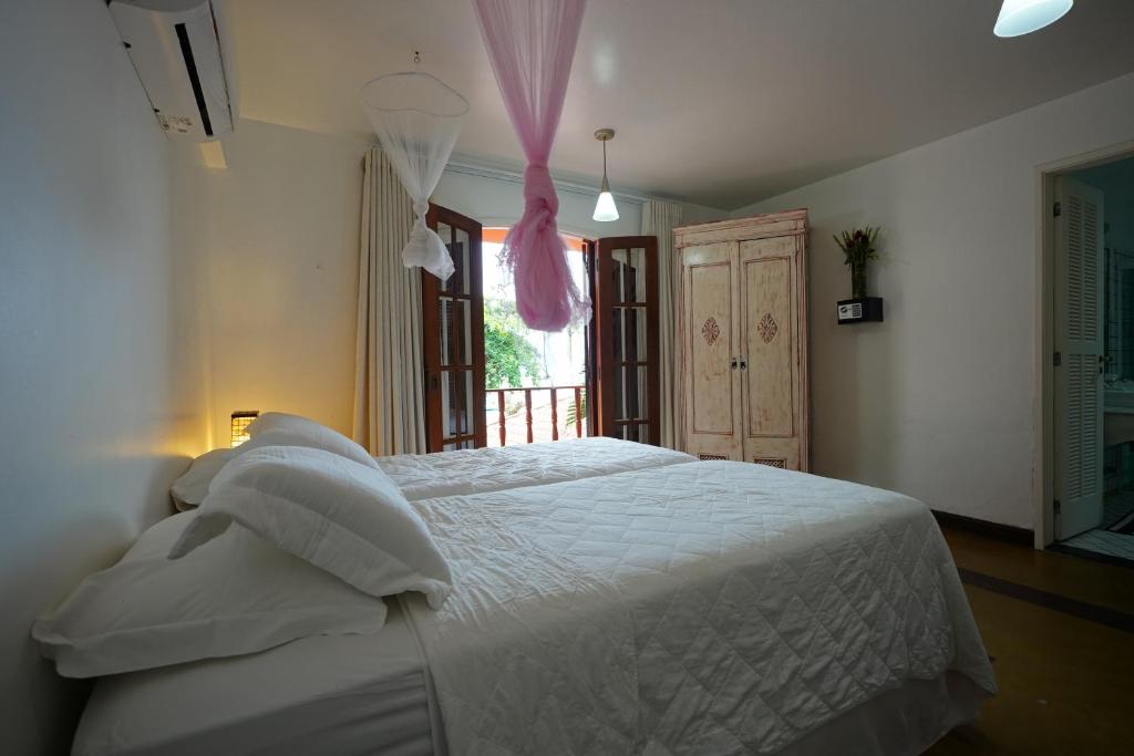 Cama ou camas em um quarto em Casa da Ilha & SPA
