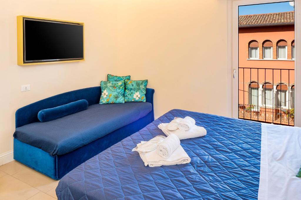 Postel nebo postele na pokoji v ubytování I Tre Re Rooms