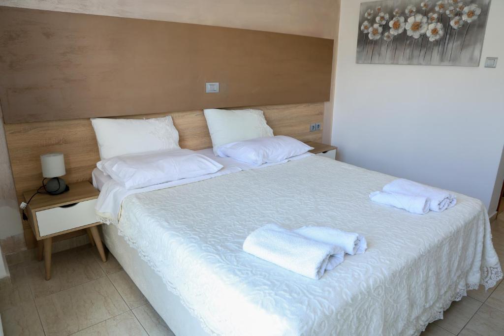 Postel nebo postele na pokoji v ubytování Marie Hotel