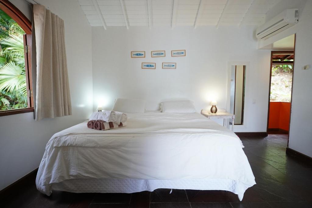 Cama ou camas em um quarto em Casa da Ilha & SPA