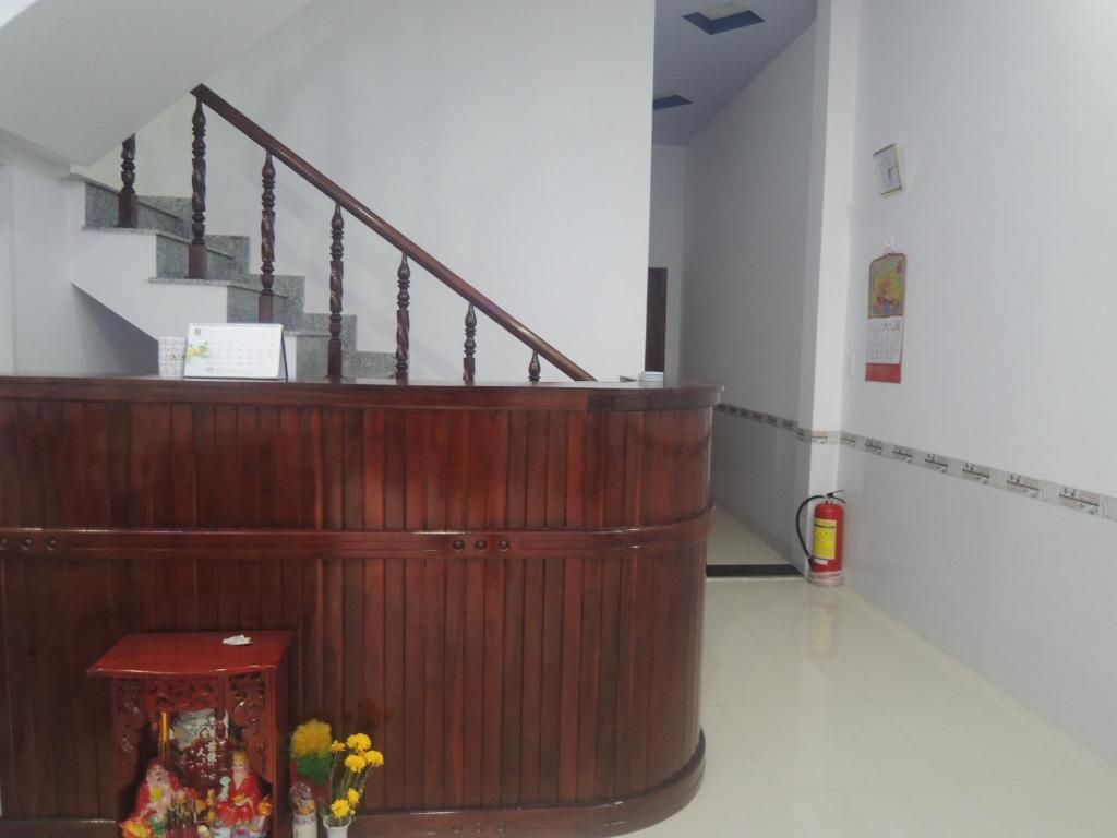 a staircase in a room with flowers on the floor at Ngan Ha Hotel in Can Tho