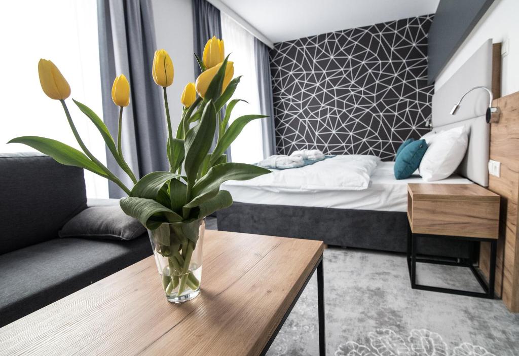 Postel nebo postele na pokoji v ubytování Hotel Limanova
