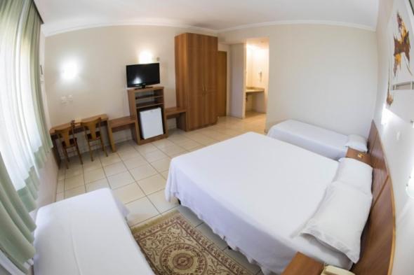 Postel nebo postele na pokoji v ubytování Hotel Itagy
