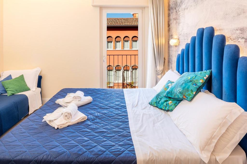 Postel nebo postele na pokoji v ubytování I Tre Re Rooms