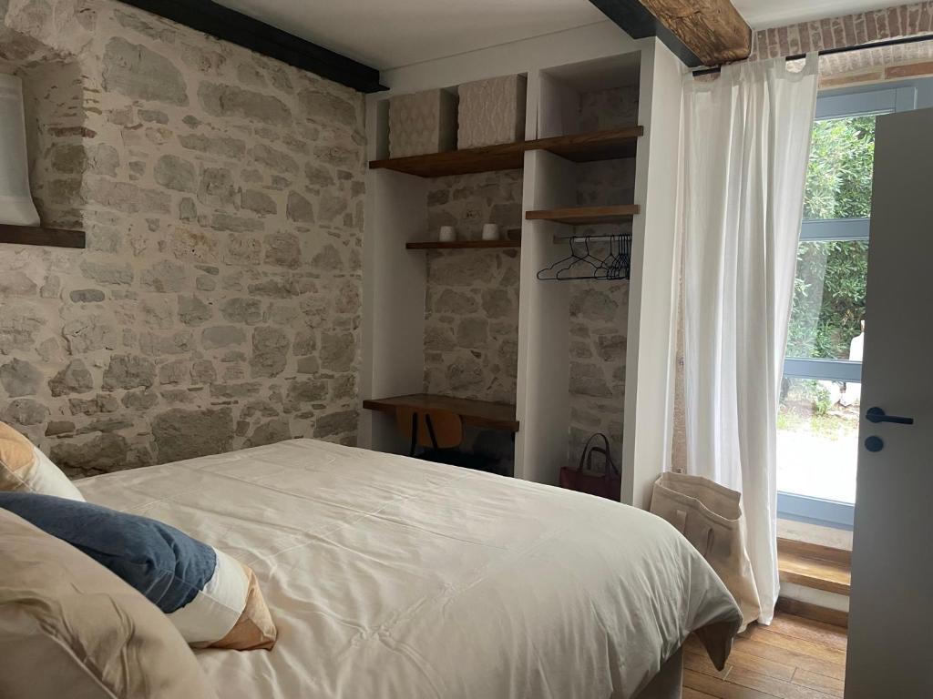 Postel nebo postele na pokoji v ubytování Loft by Villa di Piazza - a home you won’t forget
