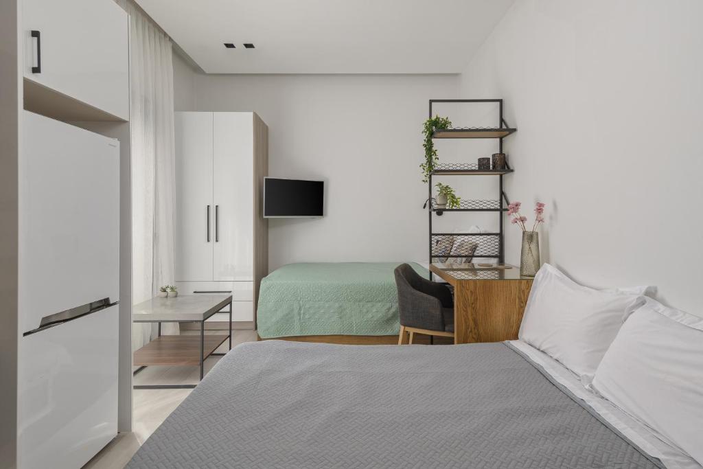 Posteľ alebo postele v izbe v ubytovaní MELIGEO Suites Center of IOANNINA