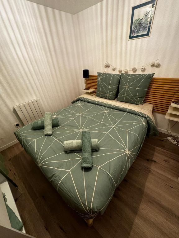 a bedroom with a large bed in a room at Centre historique - Route des vins in Thann