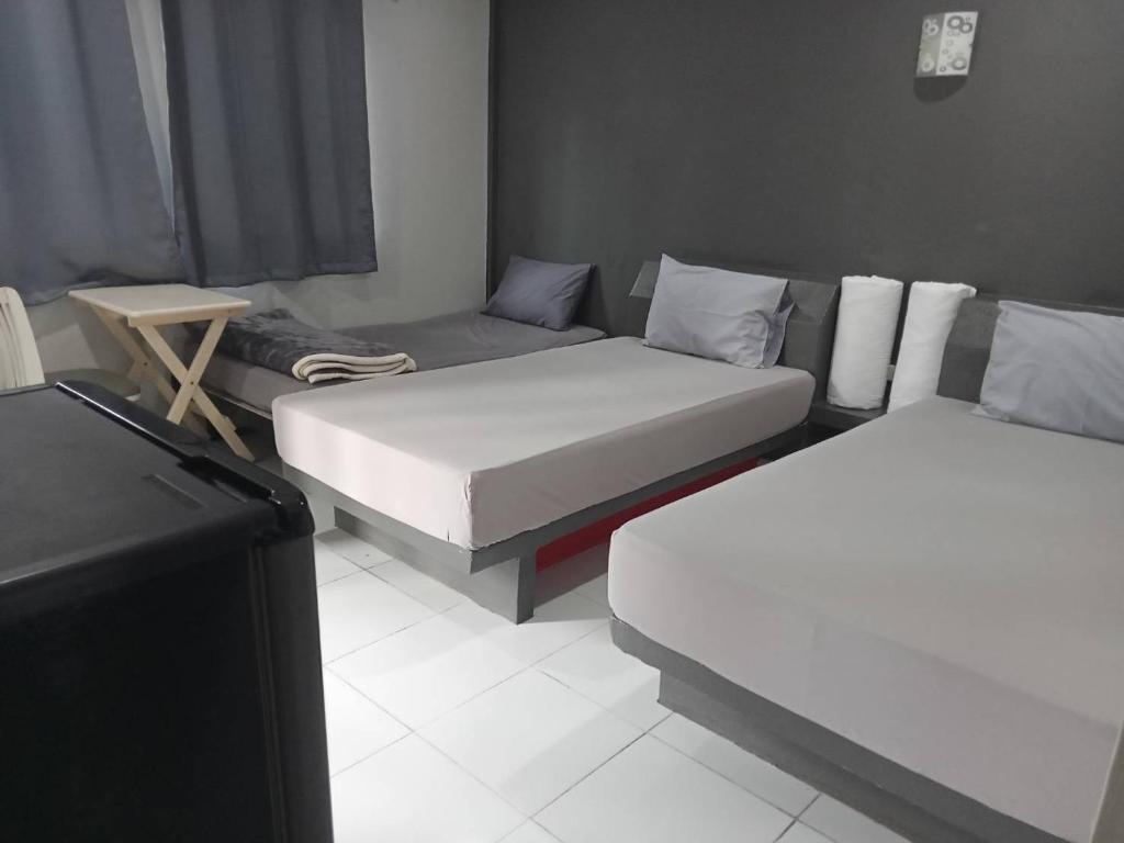 Postel nebo postele na pokoji v ubytování ภูรักษ์รีสอร์ท บ้านกรูด