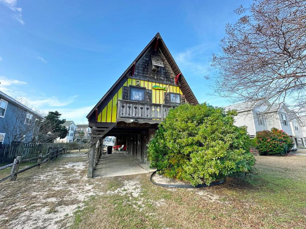 a large wooden house with a gambrel roof at CH307- The Pirate House in Kill Devil Hills