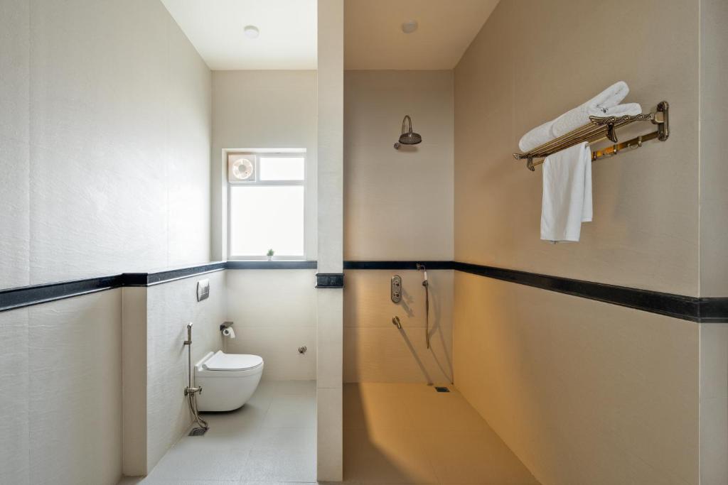 a bathroom with a toilet and a sink at Dera Jaipur Homestay in Jaipur