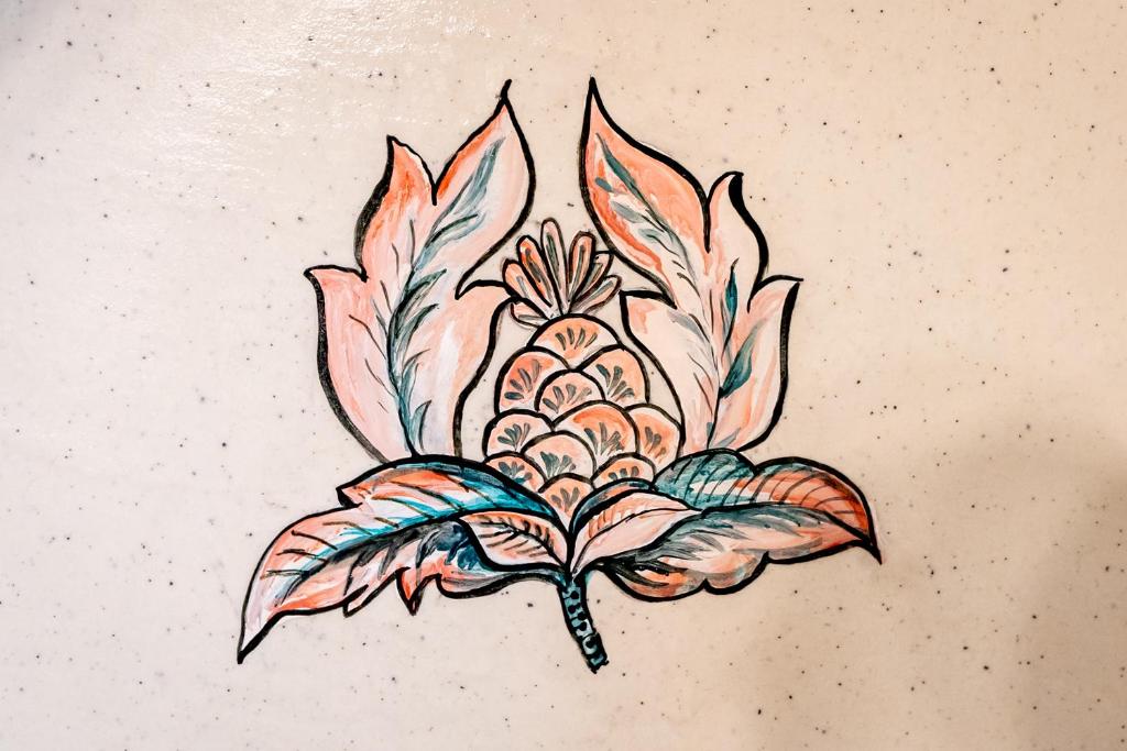 a sketch of a flower on the back of a tattoo at Dera Jaipur Homestay in Jaipur