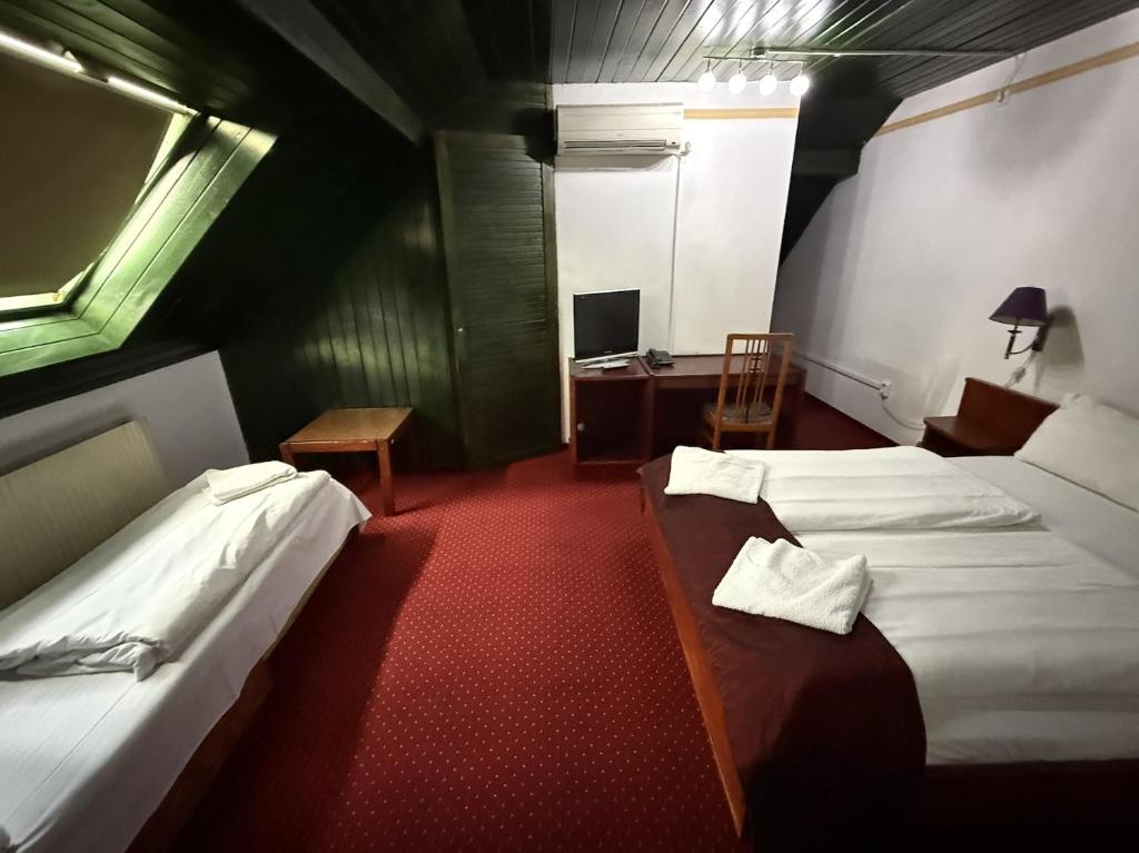 Postel nebo postele na pokoji v ubytování Hotel Amadeus