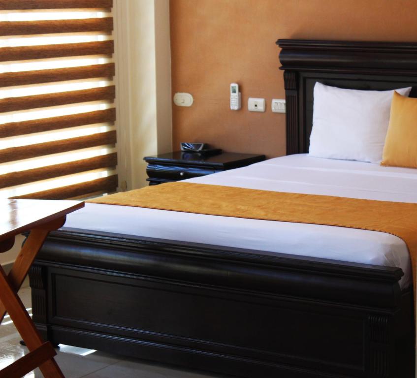 Postel nebo postele na pokoji v ubytování Hotel Flamingo