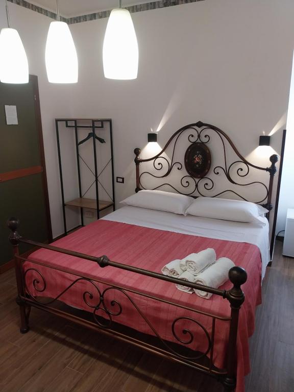 Posteľ alebo postele v izbe v ubytovaní Le Rocce Holiday Rooms