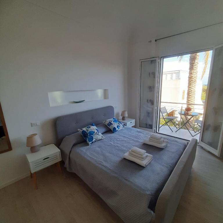 Ένα ή περισσότερα κρεβάτια σε δωμάτιο στο Ponente & Maestro Rooms