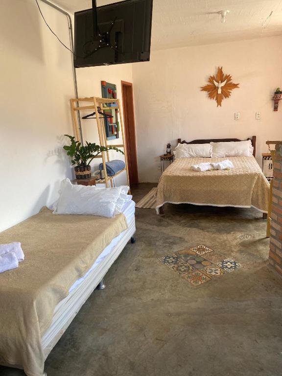 Postel nebo postele na pokoji v ubytování Mini casa Tiradentes
