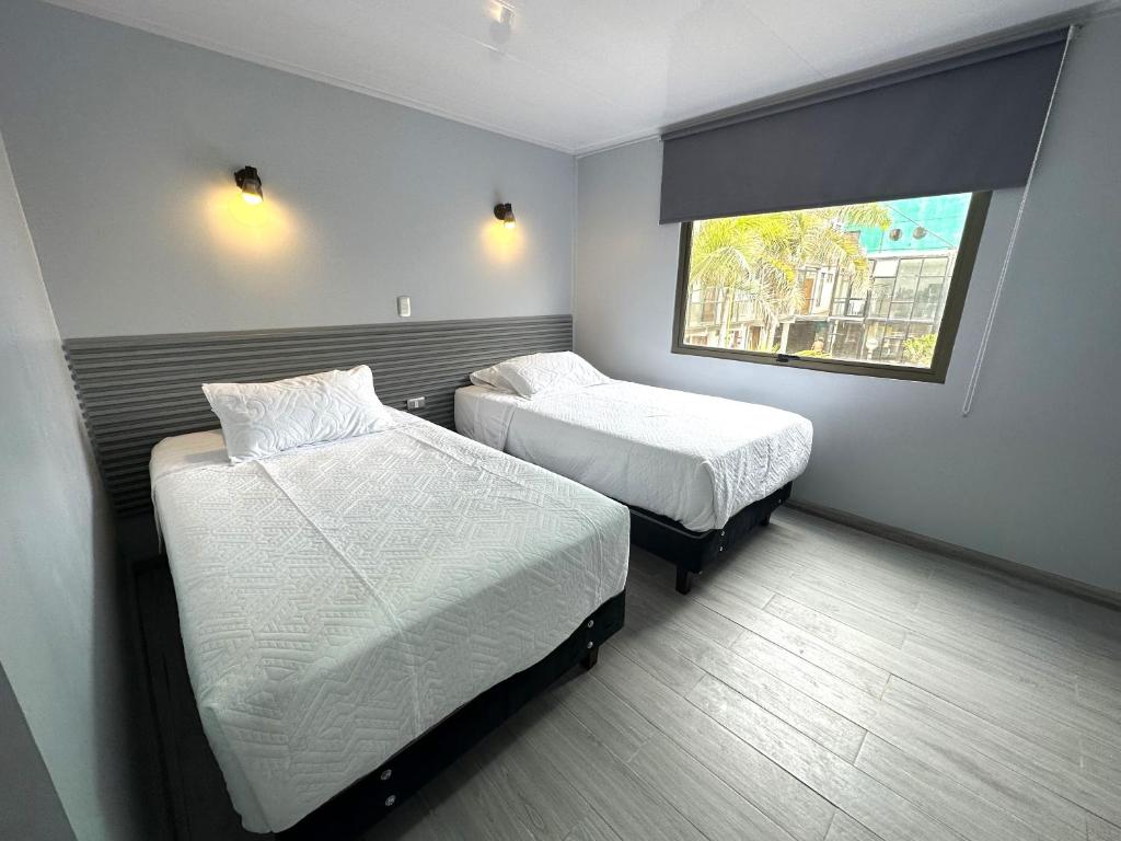 Postel nebo postele na pokoji v ubytování Hotel Divasto