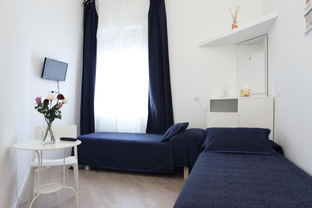 Llit o llits en una habitació de B&B Roma Olimpic