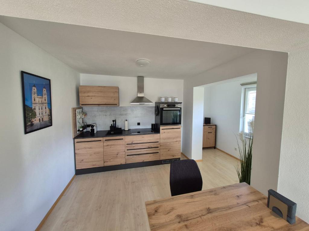 Kuchyň nebo kuchyňský kout v ubytování Apartment West