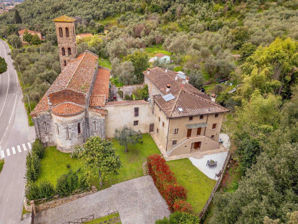 an aerial view of a house with a church at Pio Bove Rooms in Pietrasanta