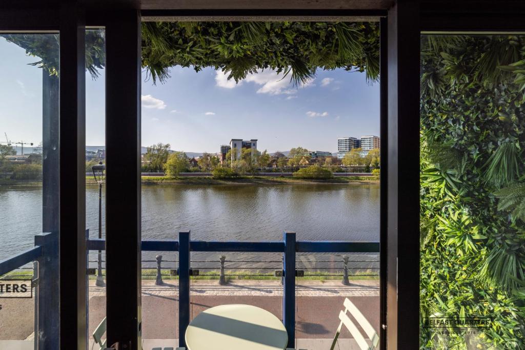 a view of a river from a window at Belfast Quarters Riverside in Belfast