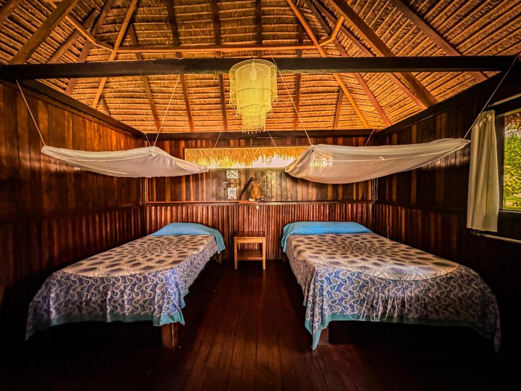 Postel nebo postele na pokoji v ubytování Corto Maltes Amazonia Lodge