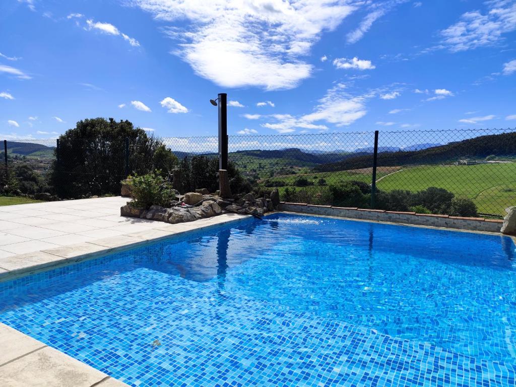 a swimming pool with a view of a mountain at Gaia Bareyo in Bareyo