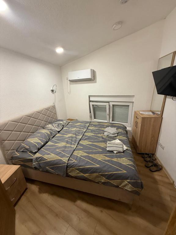 Postel nebo postele na pokoji v ubytování Rooms & Spa BJELASICA