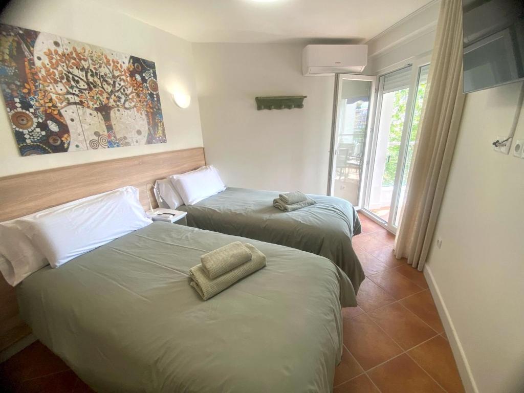 Postel nebo postele na pokoji v ubytování APARTAMENTO EN EL CENTRO CERCA DE La PLAYA