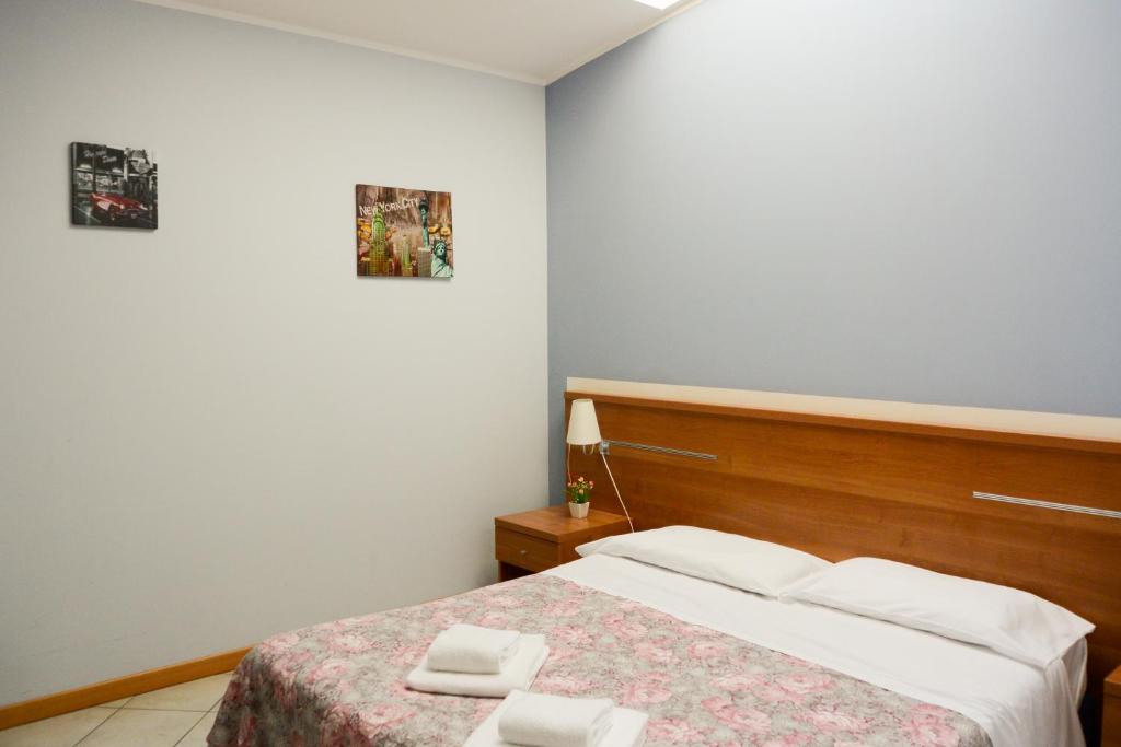 Postel nebo postele na pokoji v ubytování Albergo Meublè Abatjour