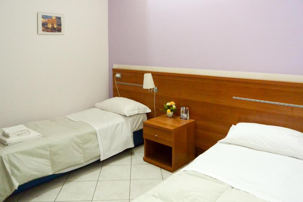 Postel nebo postele na pokoji v ubytování Albergo Meublè Abatjour