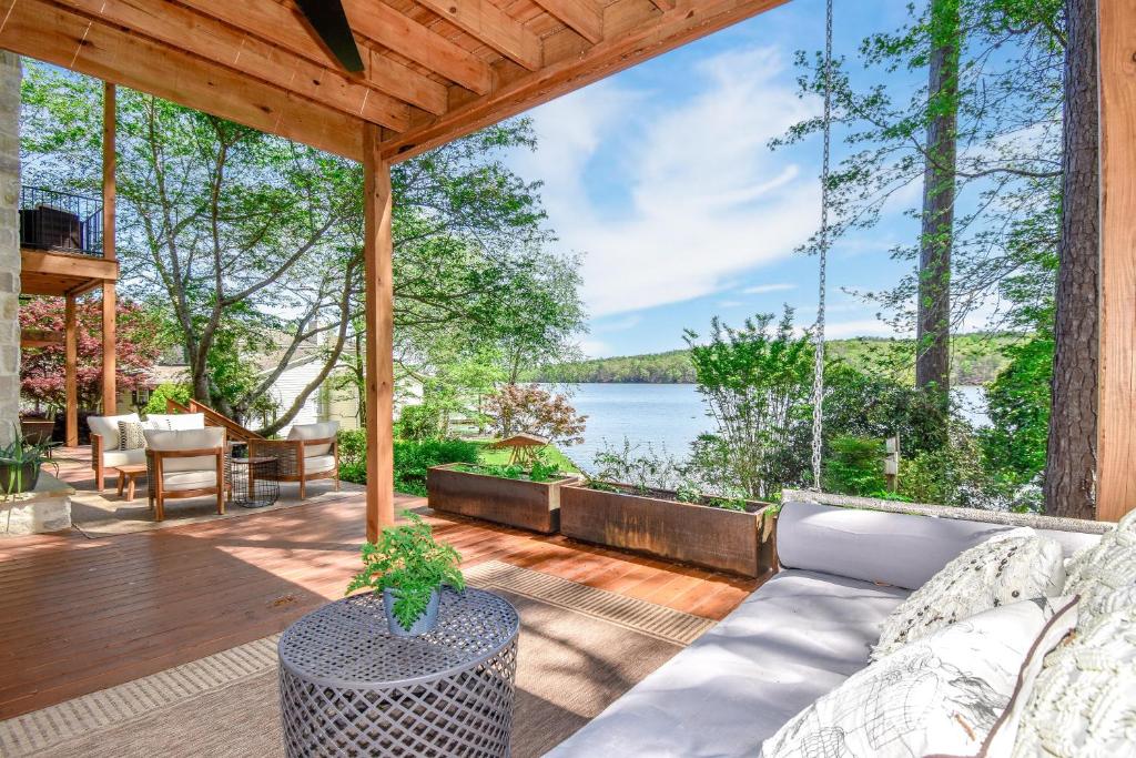 an outdoor patio with a couch and a view of the water at Eagle's View in Dadeville