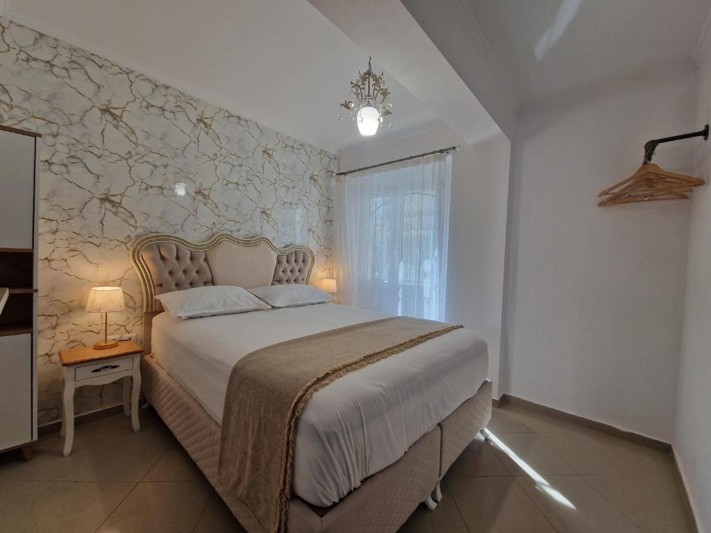 Postel nebo postele na pokoji v ubytování Iro Apartments