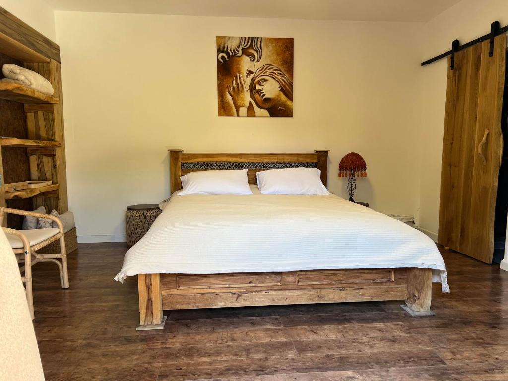 a bedroom with a large bed with white sheets at Unique Suite In Eilat in Eilat