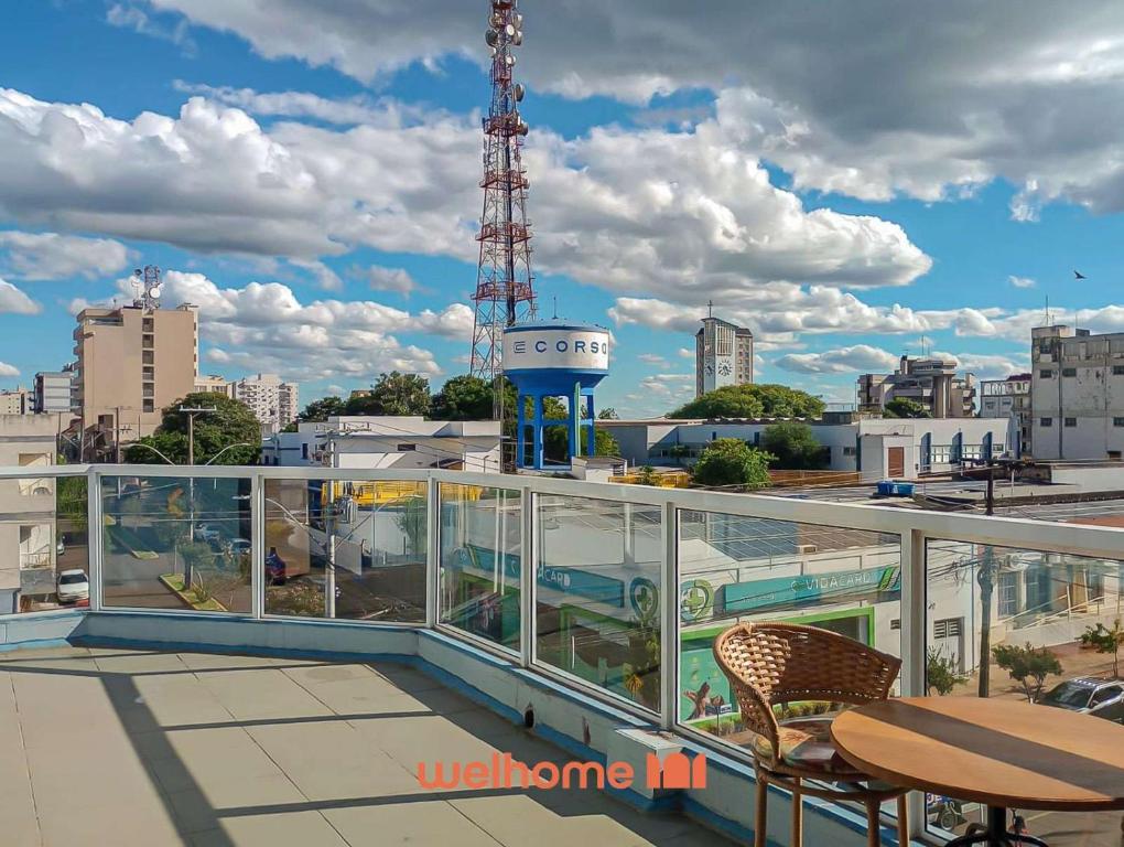 a balcony with a view of a city at Cobertura com Vista e Conforto no RS in Santo Ângelo
