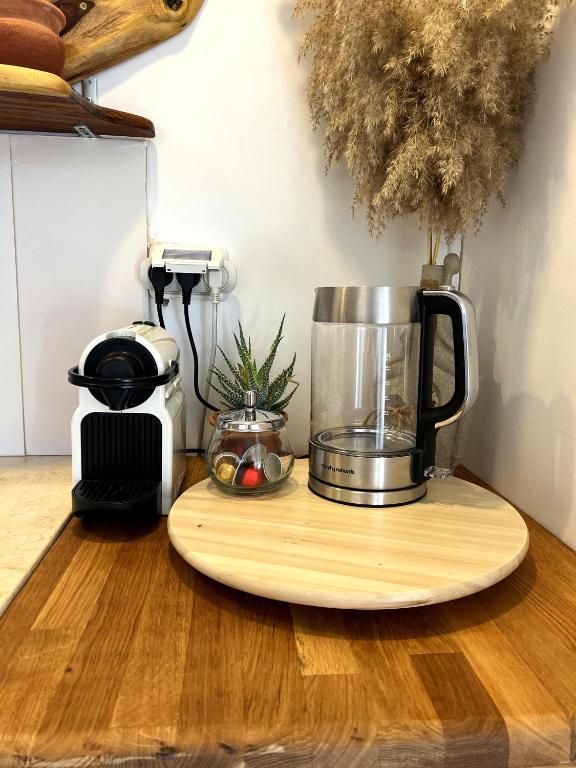 a blender sitting on a cutting board on a counter at Unique Suite In Eilat in Eilat