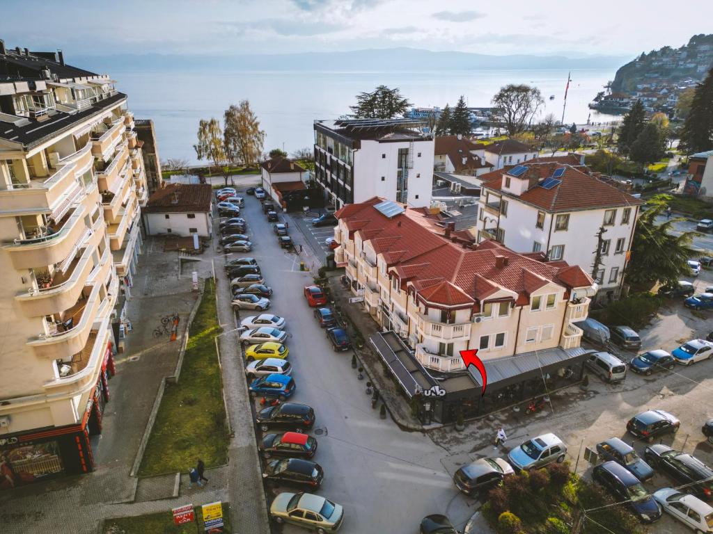 an aerial view of a city with cars parked in a parking lot at Ohrid Luxury Studios in Ohrid