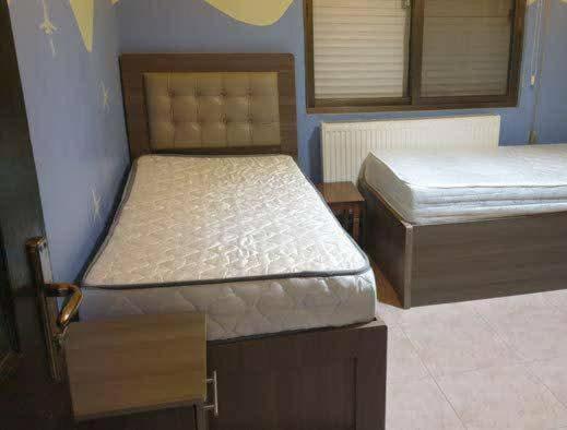 Postel nebo postele na pokoji v ubytování Bonuk House