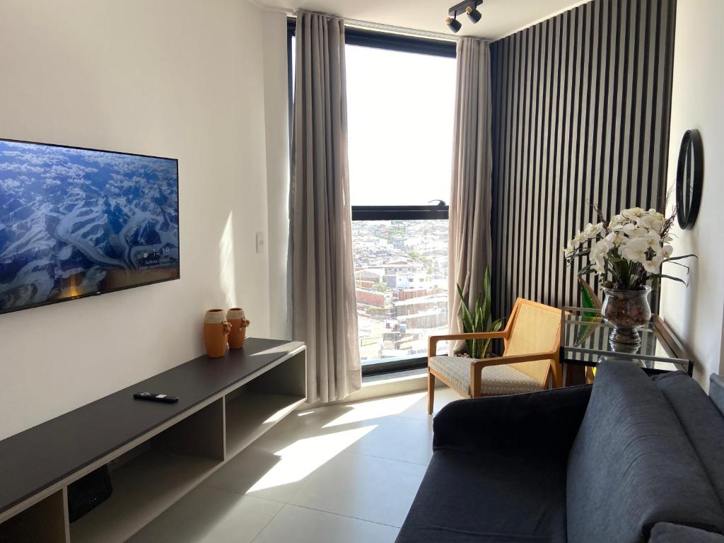 TV a/nebo společenská místnost v ubytování Quarto e Sala na Ponta Verde e Pajuçara