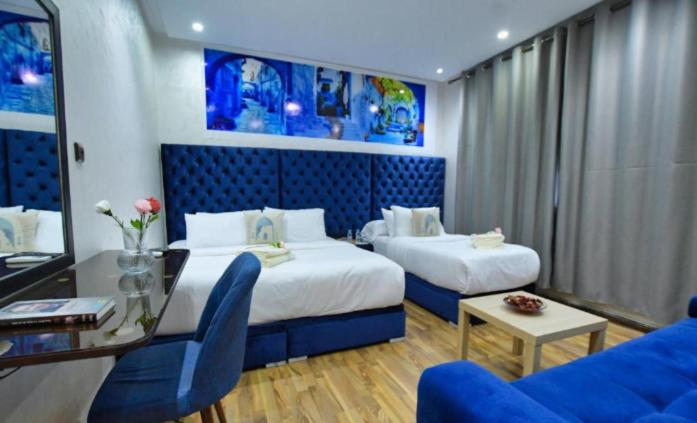Postel nebo postele na pokoji v ubytování Hotel Dar Annasr