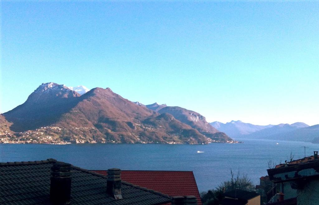 a view of a large body of water with mountains at Casa Mary in San Siro