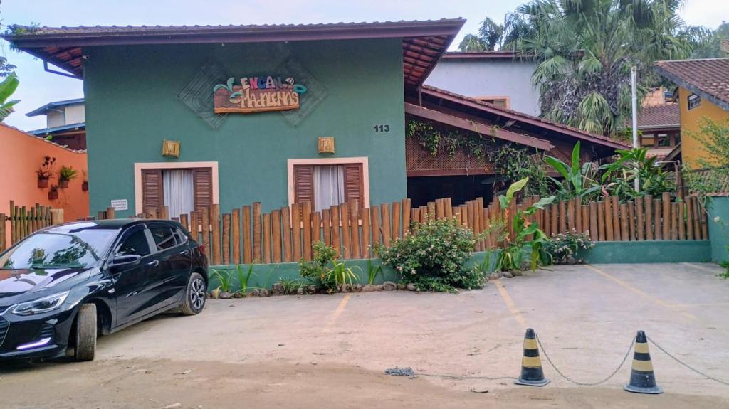 a car parked in front of a house at Encanto Mada´s Itamambuca in Ubatuba