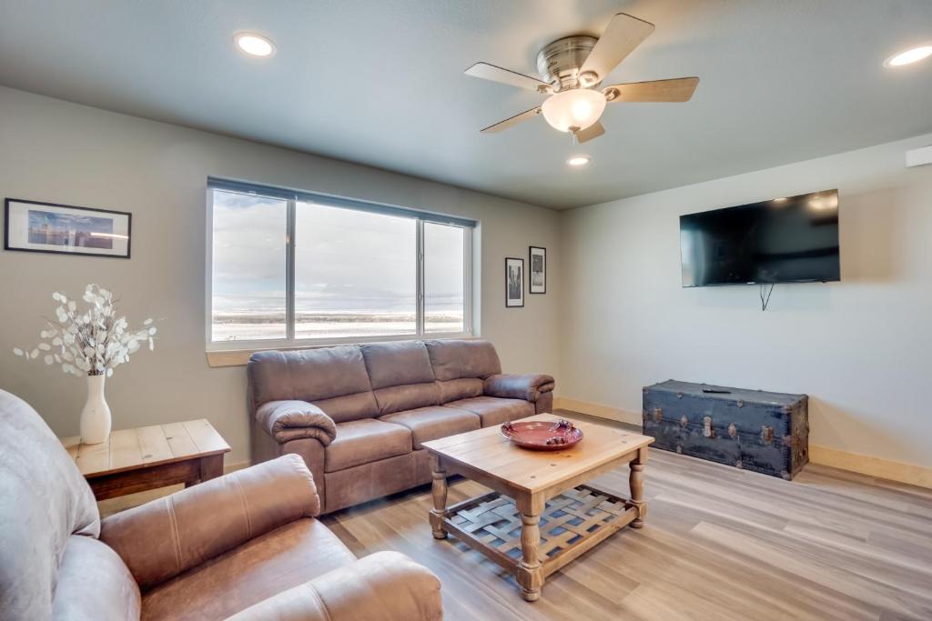 a living room with a couch and a table at Saratoga Retreat about 3 Mi to Saratoga Lake! in Saratoga