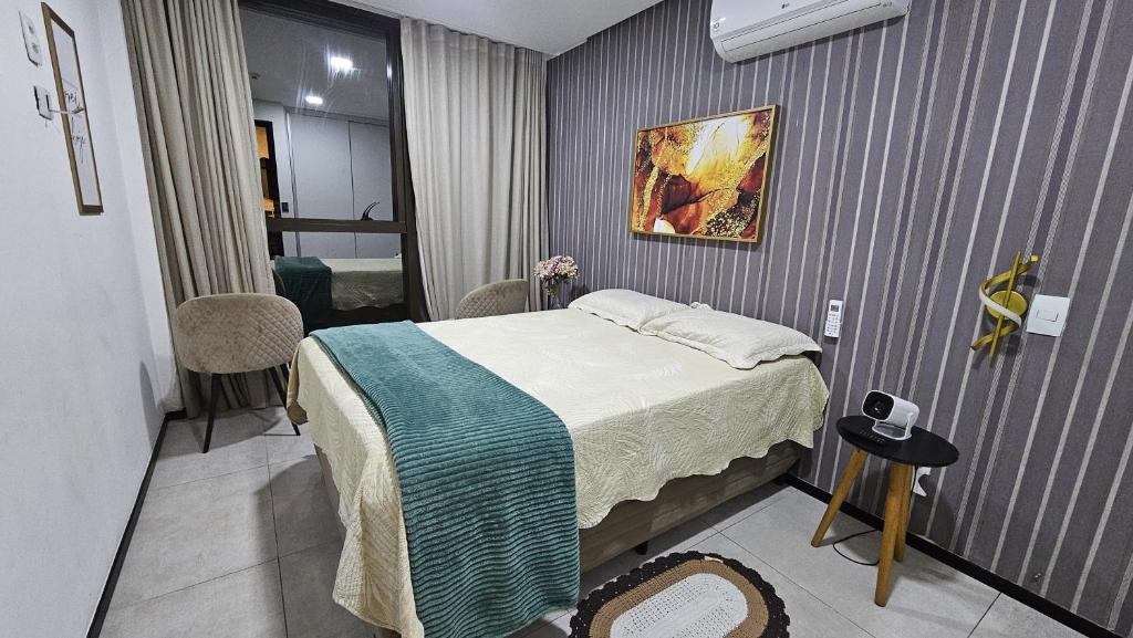 a small room with a bed and a room with a bedroom at Luxury Paiva Flat in Recife