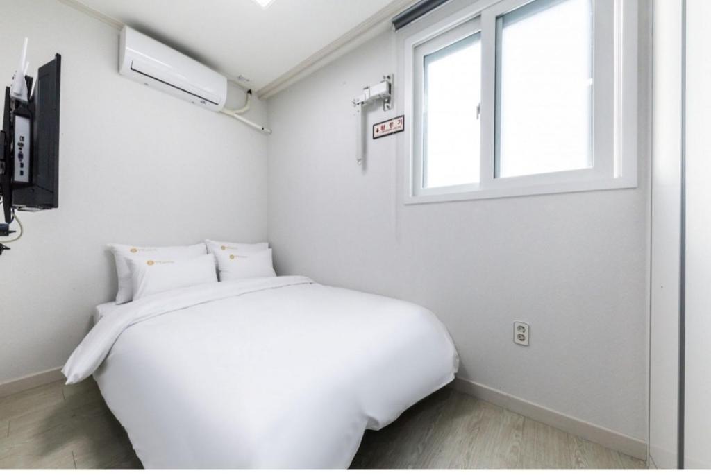 Voodi või voodid majutusasutuse JS Hostel toas